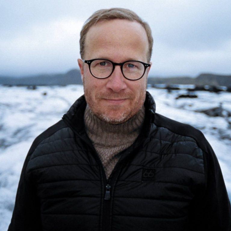 Andri Snær Magnason. A man with glasses on a glacier.