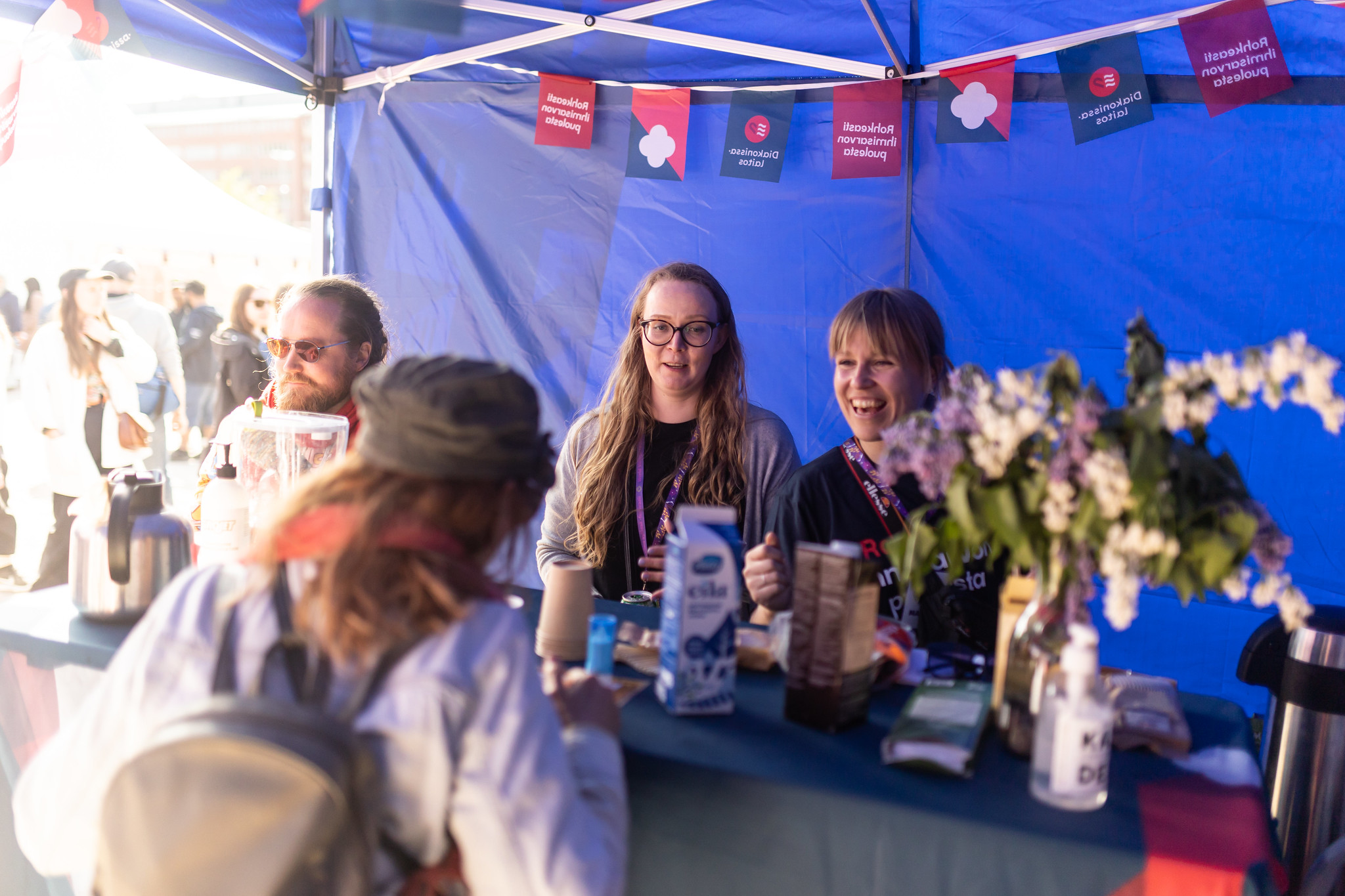 Smiling exhibitors on their stand.