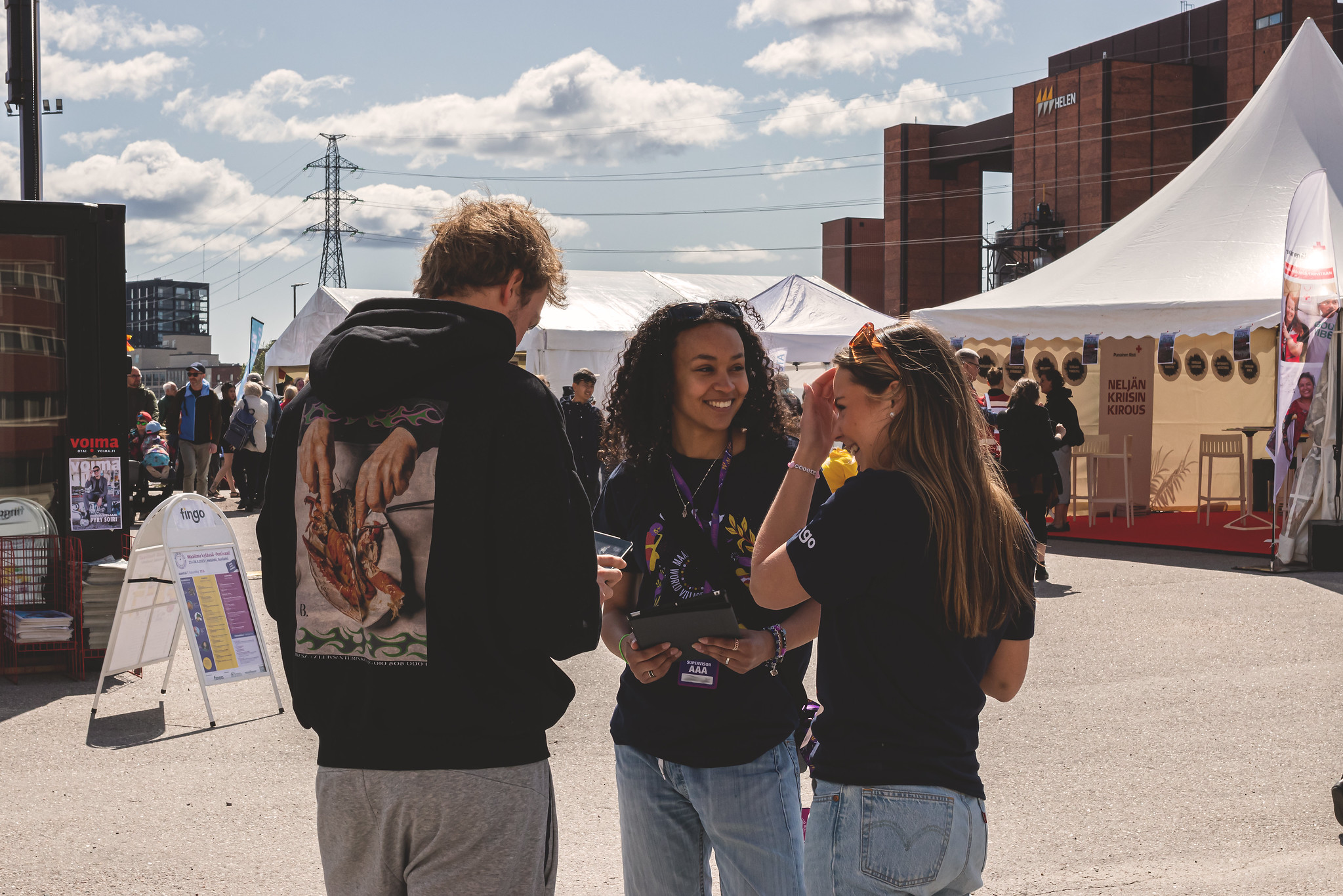 Three volunteers at the festival site.